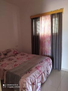 Rúm í herbergi á Guest House Maio