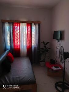 Rúm í herbergi á Guest House Maio