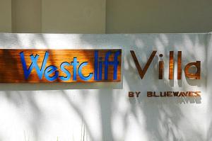 a sign for a westinoiceoice sign on a wall at Bluewaves Westcliff Villa in Boracay