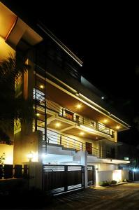 a building at night with lights on it at Bluewaves Westcliff Villa in Boracay