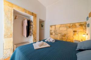 Posteľ alebo postele v izbe v ubytovaní Civico Dieci Holiday Home