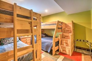 a bedroom with two bunk beds and a bed at Luxe Updated Home with Grill and Hot Tub 4 Mi to RMNP in Estes Park