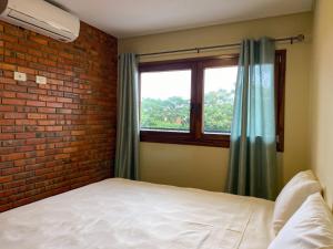 Postelja oz. postelje v sobi nastanitve Aparthotel Los Laureles
