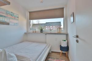 Voodi või voodid majutusasutuse Hanseat am Hang 3 - 5 Strandhafer Appartement 5 toas