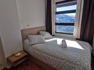 Posteľ alebo postele v izbe v ubytovaní Sierra Nevada, próximo a pistas y plaza central, vistas increíbles