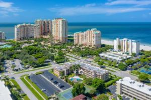 an aerial view of a city with buildings and the ocean at Prime Location I 2 Bed Setup Directly Across Street From South Beach Access in Henry Key