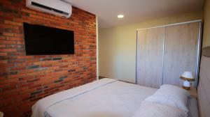 Postelja oz. postelje v sobi nastanitve Aparthotel Los Laureles