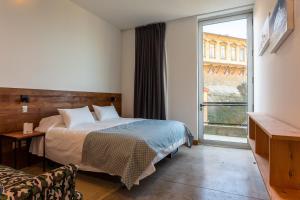 Letto o letti in una camera di Fauna Hotel