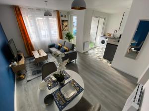 TV a/nebo společenská místnost v ubytování Superbe T2 style scandinave + 10 fotografií