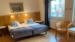 Postel nebo postele na pokoji v ubytování Hotell City + 34 fotografií