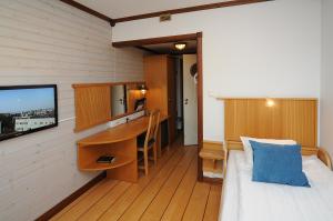 Postel nebo postele na pokoji v ubytování Hotell City