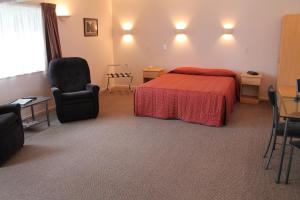 Postel nebo postele na pokoji v ubytování Riverview Motel