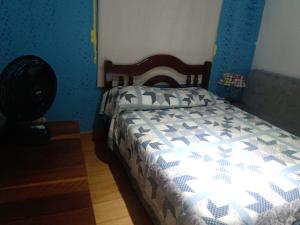 A bed or beds in a room at Casa com Piscina em Barequeçaba