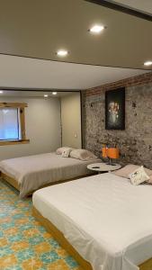 A bed or beds in a room at PEQUEÑO ENCANTO Hotel Boutique
