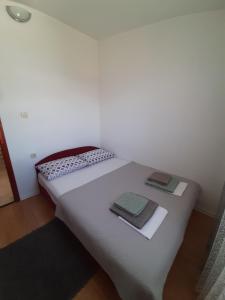 Postel nebo postele na pokoji v ubytování APARTMAN RITA