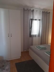 Postel nebo postele na pokoji v ubytování APARTMAN RITA