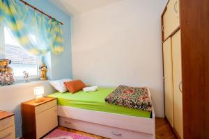 Postel nebo postele na pokoji v ubytování Apartman JOZIC