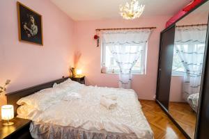 Postel nebo postele na pokoji v ubytování Apartman JOZIC