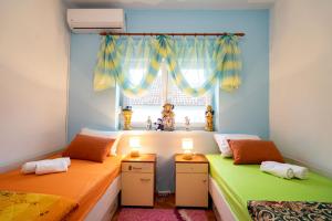 Postel nebo postele na pokoji v ubytování Apartman JOZIC
