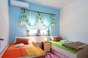 Postel nebo postele na pokoji v ubytování Apartman JOZIC