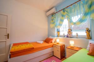 Postel nebo postele na pokoji v ubytování Apartman JOZIC