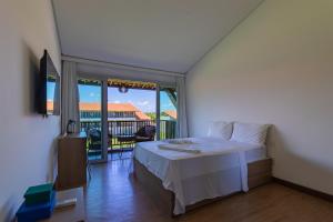 Katil atau katil-katil dalam bilik di Duplex Moderno no Club Meridional Carneiros - Apto A313 +59 gambar