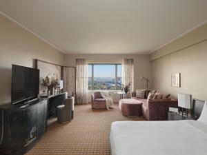 a hotel room with a bed and a television at Park Lane New York in New York