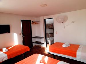 Tempat tidur dalam kamar di Hotel Villa Del Socorro