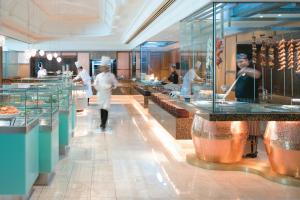 a group of chefs working in a restaurant kitchen at The Langham Melbourne in Melbourne +20 photos