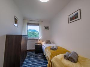 Łóżko lub łóżka w pokoju w obiekcie ERZHAUS Apartments
