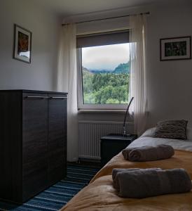 Łóżko lub łóżka w pokoju w obiekcie ERZHAUS Apartments