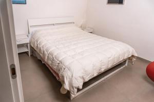 Ein Bett oder Betten in einem Zimmer der Unterkunft Dimoradesign