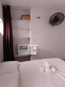 Säng eller sängar i ett rum på Casa Dunas Cabo Frio