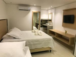 Кровать или кровати в номере Suites Amma Noronha