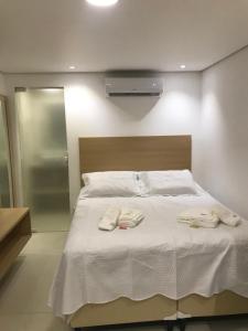 Кровать или кровати в номере Suites Amma Noronha
