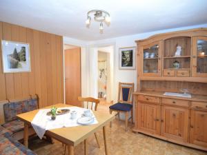 a dining room with a table and a kitchen at Holiday home in Ramsbeck with garden in Bestwig