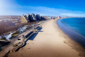 an aerial view of a beach with buildings and the ocean at Charming Boston Retreat 3BR Parking Perfect for Families & Groups in Revere