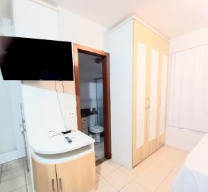 a bathroom with a sink and a toilet at #Flats Studio 45 Bueno Oeste in Goiânia