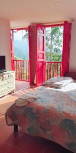Cama o camas de una habitación en Hotel Natura Cocora