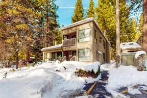 a house in the snow with snow around it at Maison de Montagne in Incline Village