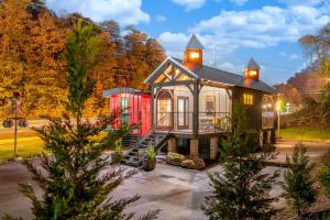 a tiny house with a lighthouse on top of it at Smoky Mountain Station in Pigeon Forge