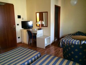 Postel nebo postele na pokoji v ubytování Hotel Brennero e Varsavia