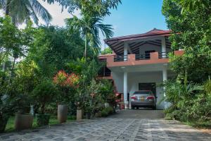 a car parked in front of a house at Sadee's Place in Dambulla