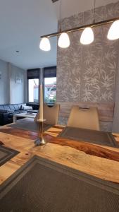a dining room with a table with a candle on it at FeWo an der Ostsee Nr. 2 in Rerik