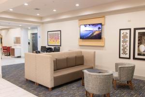 a waiting room with a couch and chairs at Holiday Inn Express Hotel & Suites Temple-Medical Center Area by IHG in Temple