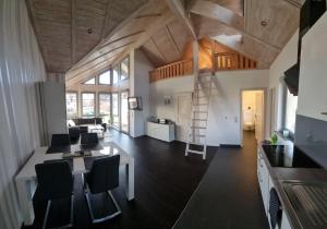 a kitchen and living room with a table and chairs at FeWo an der Ostsee Nr. 4 in Rerik