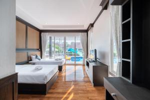 Postel nebo postele na pokoji v ubytování RimLay Beachfront Pool Villa