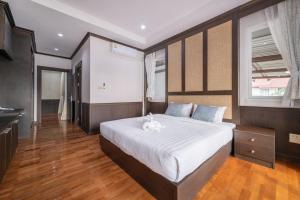 Postel nebo postele na pokoji v ubytování RimLay Beachfront Pool Villa