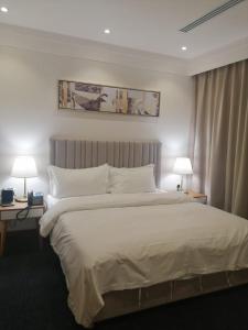 Ένα ή περισσότερα κρεβάτια σε δωμάτιο στο فندق ايون الندى