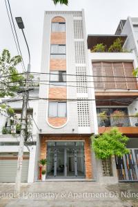 an apartment building with a white facade at Carol Homestay & Apartment Da Nang 3 in Da Nang